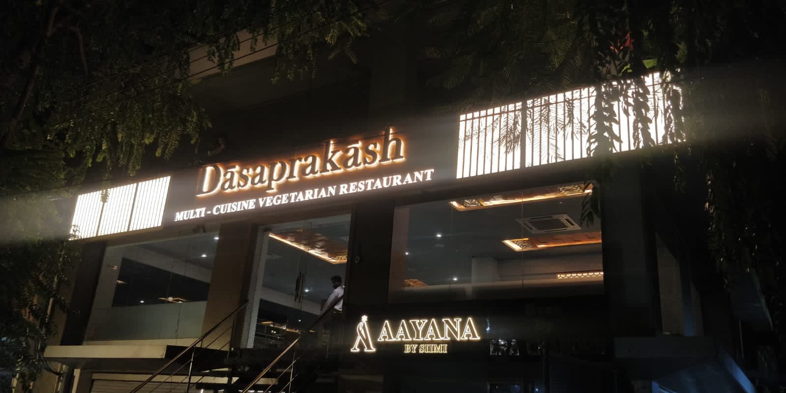 Illuminated Dasaprakash restaurant facade at night