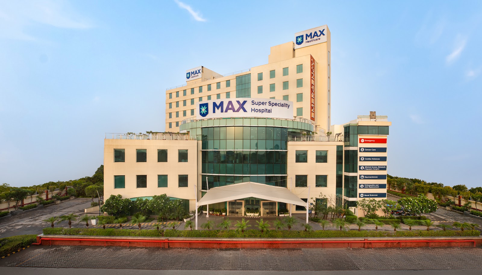 Front exterior of Max Super Speciality Hospital Shalimar Bagh with MAX signage above the glass entrance canopy